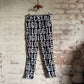 1990s Moschino Print 'Logo' Trousers